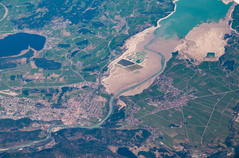 Aerial view of an estuary feeding through a town into a lake