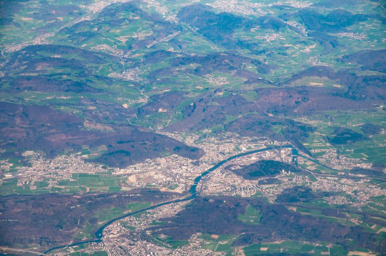 Aerial view of the twin towns on the river and the surrounding countryside