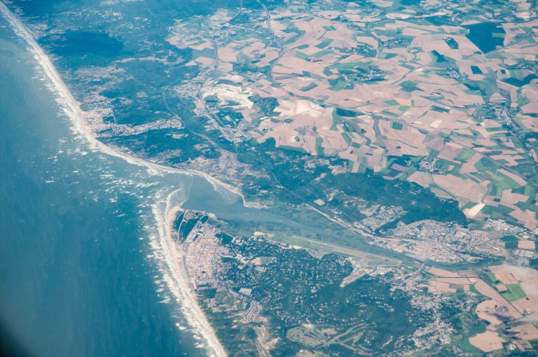 Aerial view of a river estuary flowing into the sea